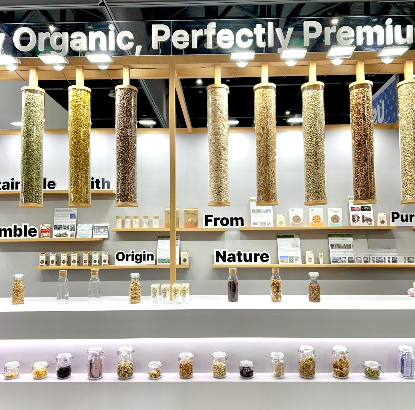 Columns of certified organic nuts and grains from the YOUGAONE brand exhibition